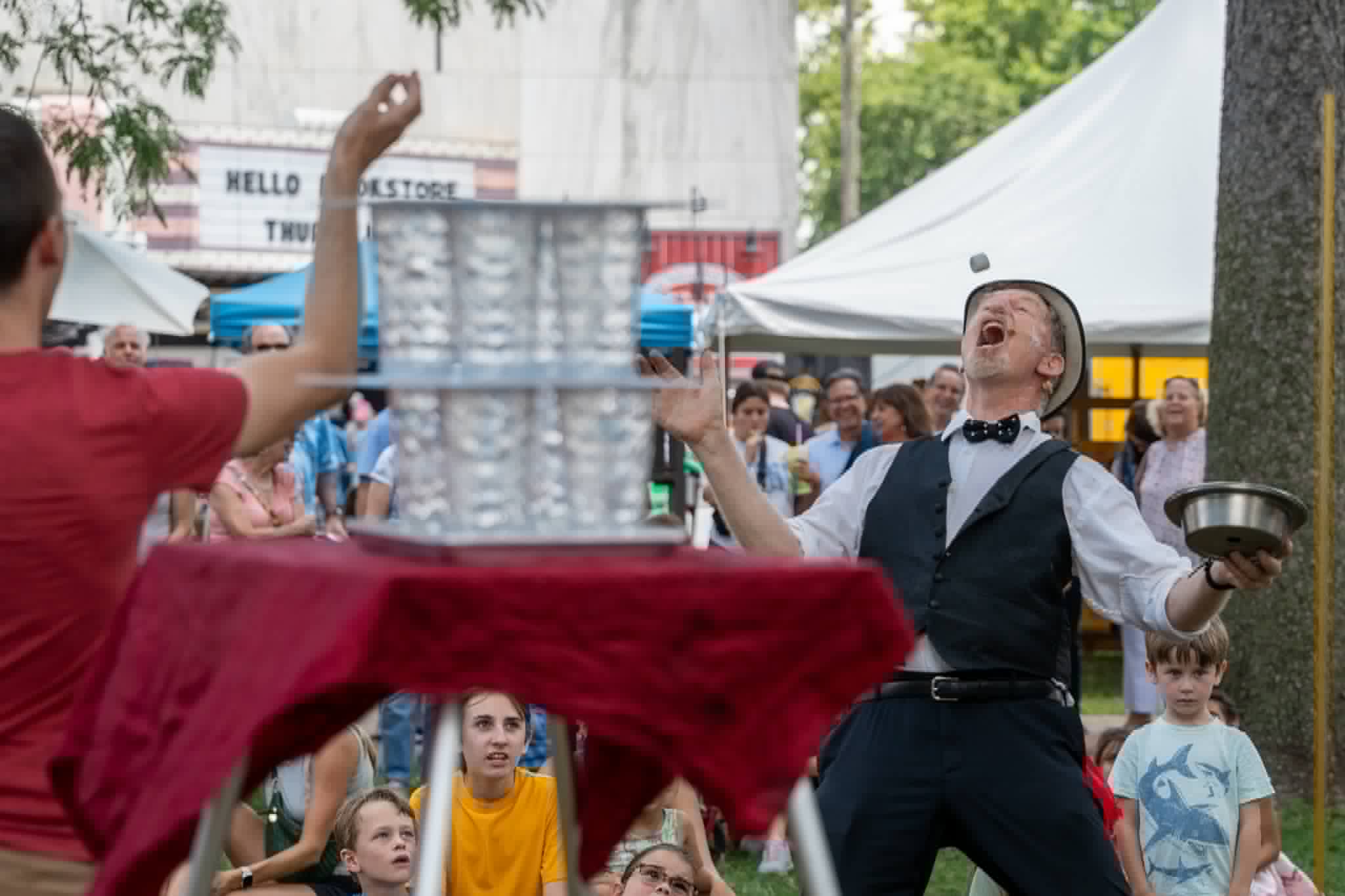 Marshmallow catch stunt beside a balanced tower of glasses โ The Funny Waiter Show