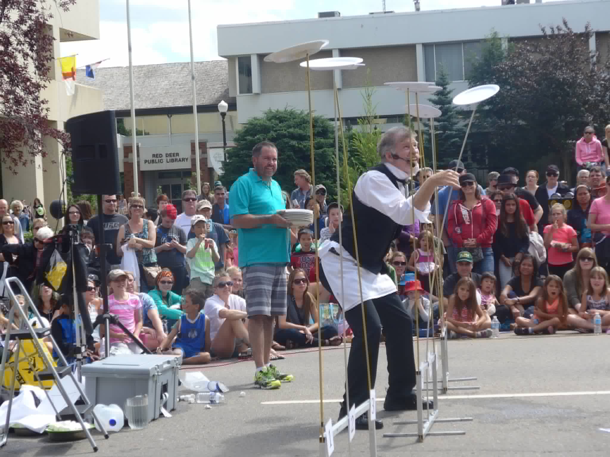 Plate spinning show with an audience volunteer in Red Deer, Alberta