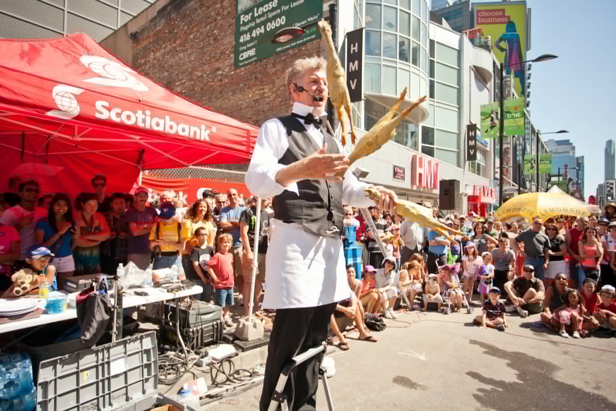 Juggling rubber chickens at a Toronto street festival on Yonge Street
